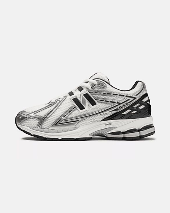 Plugmarket New Balance 1906r sneakers in black, white, and grey with mesh and synthetic overlays.