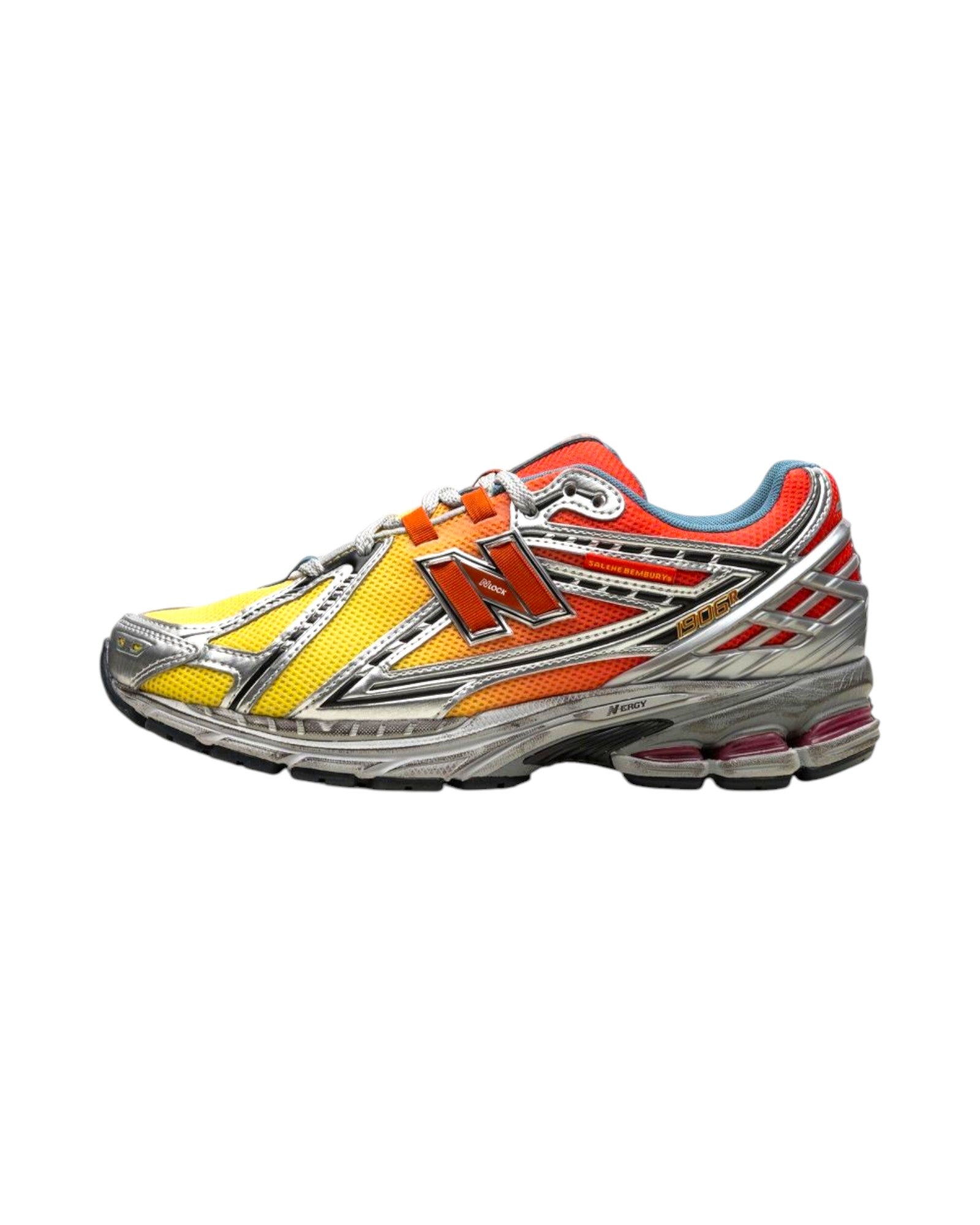 Plugmarket - New Balance 1906r sneakers in yellow, orange, and silver with a mesh upper and N logo.