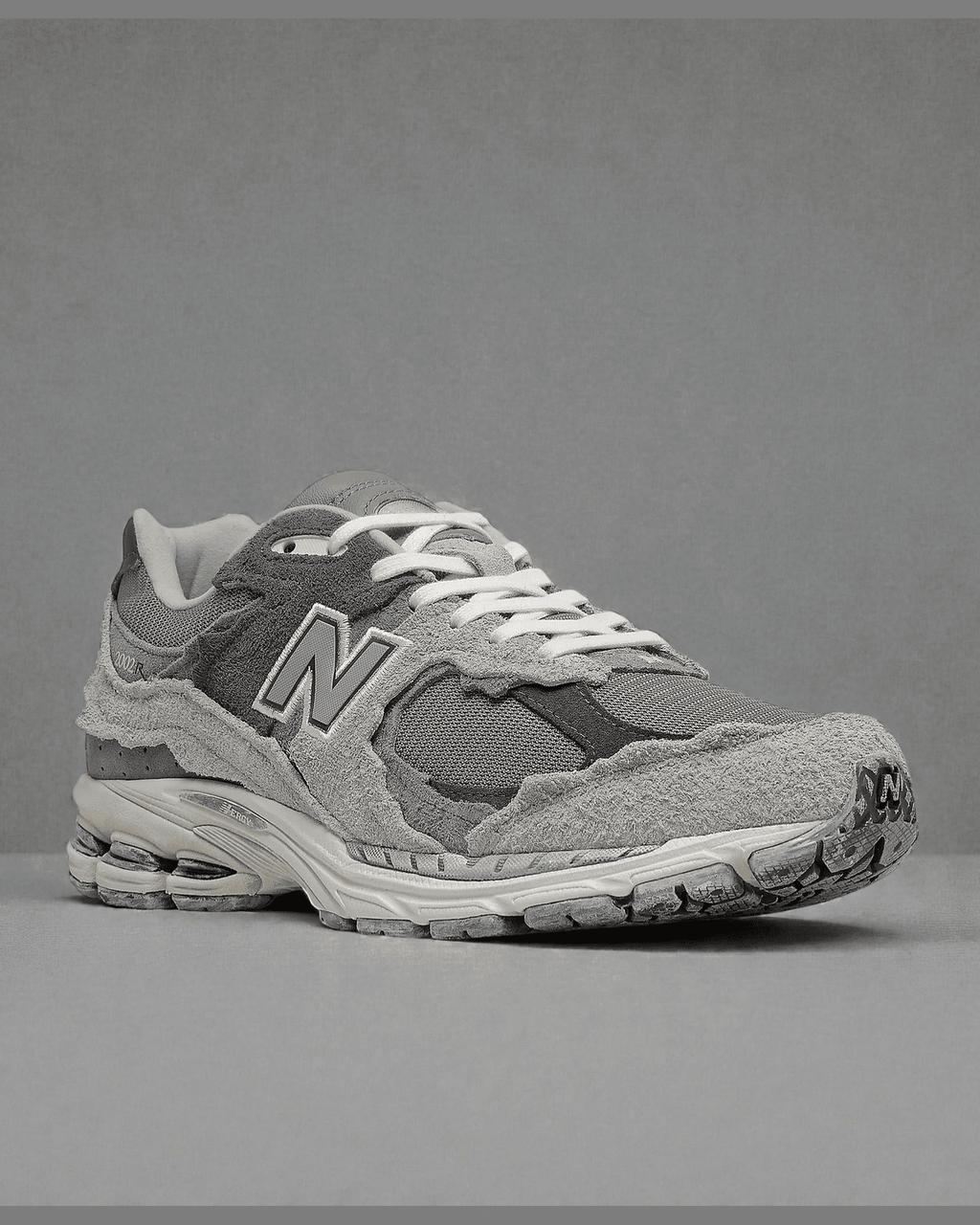 Plugmarket - New Balance 2002R Protection Pack Rain Cloud sneakers in grey suede and mesh with distressed detailing.