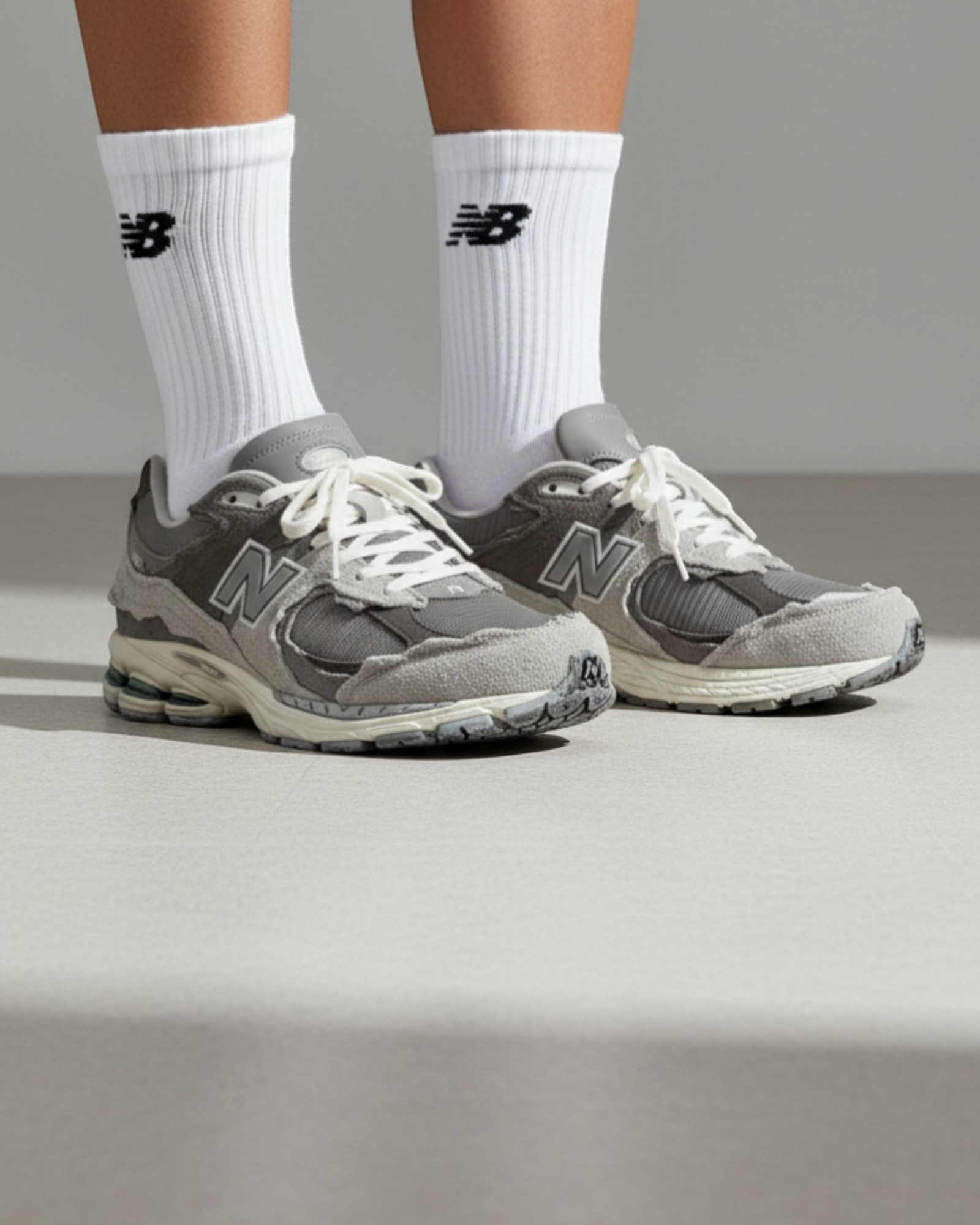 Plugmarket - New Balance 2002R Protection Pack Rain Cloud sneakers in grey suede and mesh with distressed detailing.