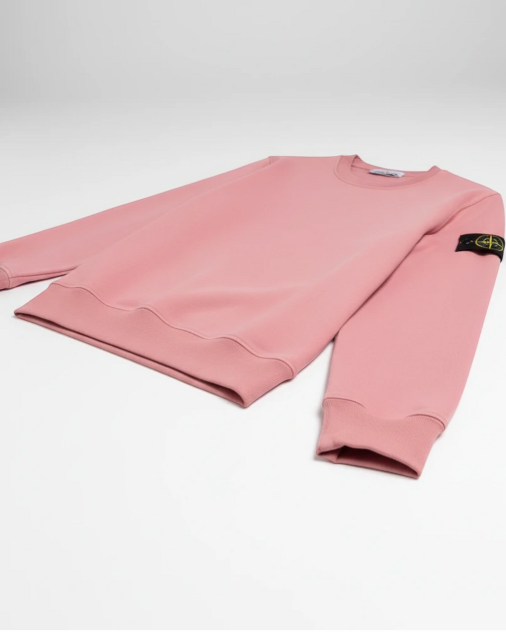 Plugmarket pink crewneck sweatshirt with Stone Island logo patch on sleeve. Cotton blend.